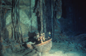 a fallen chandelier seen in the wreckage of the Titanic, deep below the sea